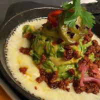 Chori-Queso Guacamole · melted oaxaca cheese + spicy pork chorizo + chile morita salsa + house-made corn chips