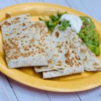 The Monterey Quesadilla · A flour tortilla, Monterey Jack cheese with fresh guacamole and sour cream on the side.