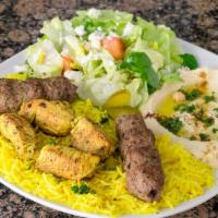 Mix Combo Platter · 1 skewer of chicken kabob and 2 kofta kabob over seasoned rice served with hummus, house sal...