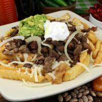 Asada Fries  · Beans cheese guacamole and carne asada....