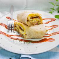 Regular Breakfast Burrito  · 2 eggs, cheese, hash browns, bacon or sausage, and pico.
