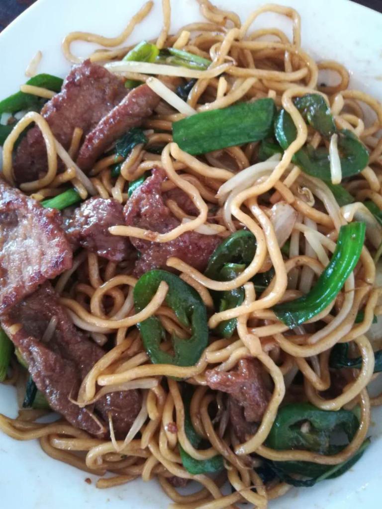 2. Beef Lo Mein · Classic Chinese noodles with carrots, bean sprouts, yellow and green onions in a light brown sauce with a hint of sesame oil.