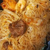 4. Singapore Rice Noodles · Spicy, gluten free. Thin rice vermicelli wok tossed in a spicy aromatic curry seasoning alon...