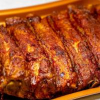 Large  Baby Back Ribs  · Tender, marinated and seasoned served with 2 large sides and cornbread. 