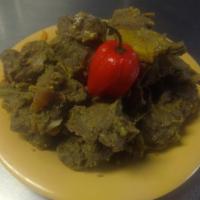 3b. Curry Goat · Spiced sauce.
