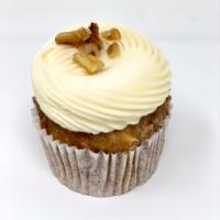 Carrot Cake · A spiced carrot cake cupcake with a vanilla cream cheese frosting 
