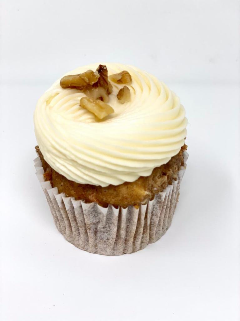 Carrot Cake · A spiced carrot cake cupcake with a vanilla cream cheese frosting 