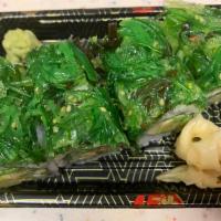 Celtics maki roll · Asparagus avocado cucumber top with seaweed .