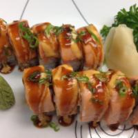 Spicy Baked Salmon Maki · Crabstick, avocado cucumber topped with salmon baked to perfection with scallion.