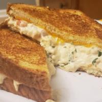 Tuna Salad MELT Meal Lunch · Tuna salad with spinach, onion, tomatoes and eggs top with melted sharp cheddar cheese on bu...