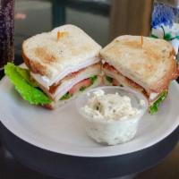 Turkey Club House Sandwich · Turkey, bacon, tomato, lettuce and mayo on toasted sourdough.