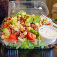Elleti Salad · All romaine lettuce topped with chicken breast, bacon, avocado, tomato and croutons with our...