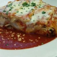  Lasagna ala Bolognese Dinner · A hearty portion of lasagna layered with ground beef, ricotta and then topped with meat sauc...