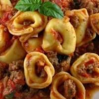 Tortellini Bolognese · Served with house salad and garlic bread.