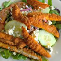 Buffalo Chicken Salad · Crispy Buffalo chicken and crumbled blue cheese over our garden salad. Served with garlic br...