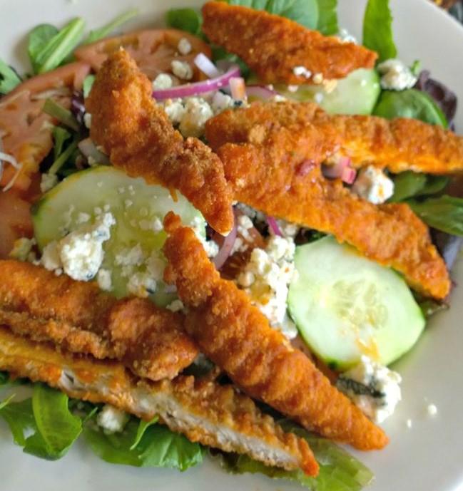 Buffalo Chicken Salad · Crispy Buffalo chicken and crumbled blue cheese over our garden salad. Served with garlic bread.