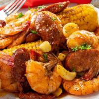 Shrimp Shabang · Perfectly seasoned 1lb of cajun peel & eat shrimp, 2 pieces of corn on the cob, and sliced s...
