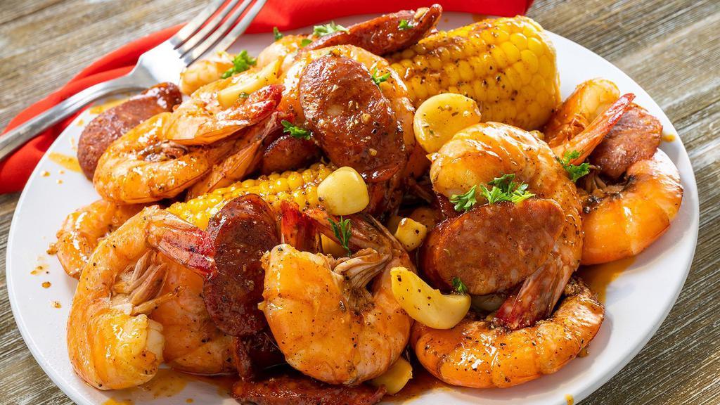 Shrimp Shabang · Perfectly seasoned 1lb of cajun peel & eat shrimp, 2 pieces of corn on the cob, and sliced sausage.