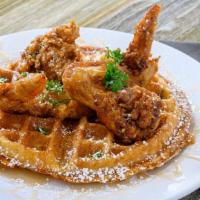 Chicken & Waffle with House Syrup · Delicious Belgian waffle with our famous fried chicken.