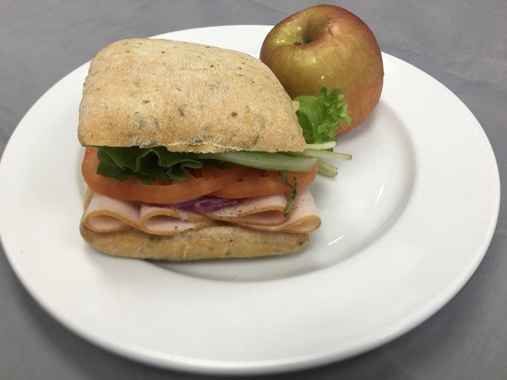 Turkey Sandwich Box · Sliced Turkey with lettuce, tomato, and red onion on Focaccia bread. Served with mayo and mustard on the side.