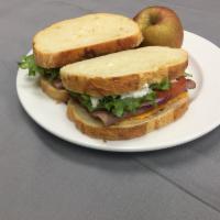 Roast beef and Cheddar · Sliced roast beef, cheddar cheese, lettuce, tomato, red onion, and our own horseradish mayo ...