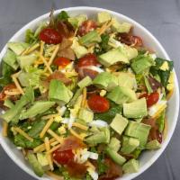 Cobb Salad · Mixed lettuce, hard boiled egg, tomatoes, bacon, shredded cheddar cheese, avocado, and your ...