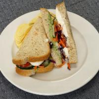 Veggie Sandwich Box · Cucumber, roasted tomatoes, feta cheese, carrot, red cabbage,  mayo, and house made herb eda...