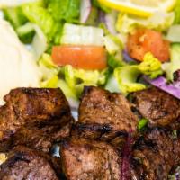 Beef Kabab plates with 2 Sides · Served with white rice pita bread, 2 choices of salad and Hummus