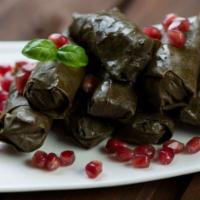 Grape Leaves · 6 pieces. Stuffed with rice, vegetables, and olive oil.