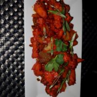Chilly Chicken · Classic Indo Chinese wok tossed chicken.