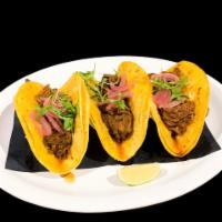 Birria Taco · Pulled beef slow-cooked, marinated with dry chiles.