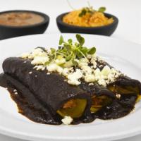 Enchiladas de mole poblano · Chicken, Beef or Mexican cheese. Served with Mexican rice and beans