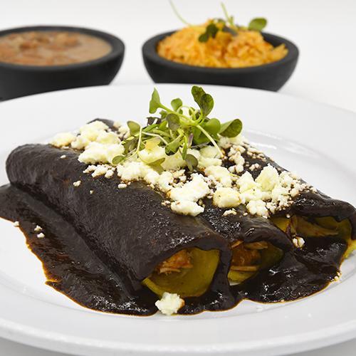 Enchiladas de mole poblano · Chicken, Beef or Mexican cheese. Served with Mexican rice and beans
