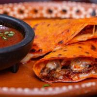 Quesa birria · 3 home made corn tortillas, melted cheese with slow cooked Birria broth