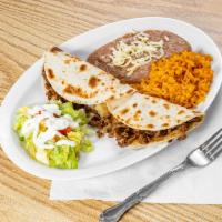 Quesadillas · Two flour tortilla with melted cheese your choice of meat.