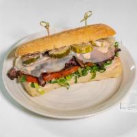 Hot Pastrami Sando · Grilled onions, Provolone, lettuce, tomato, pickle, 1000 island dressing and ciabatta roll.