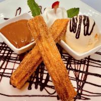 Churros · Made fresh to order, cooked until golden brown with dulche de leche dip.