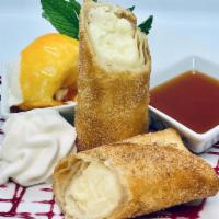 Fried Cheese Cake · Rich, smooth cheesecake, with a slight tangy finish, rolled in a melt-in-your-mouth, flaky p...