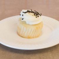 Cannoli Cupcake · White cupcake with cannoli filling. Cream cheese frosting topped with cannoli shell crumbs a...
