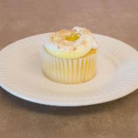 Lemon Meringue · Lemon cupcake with a lemon curd filling. Whipped icing and topped with pie crumbs.