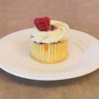 Lemon Raspberry Cheesecake · Lemon cupcakes with a cheesecake filling topped with raspberry filling a cream cheese frosti...