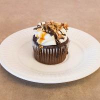 Turtle Cheesecake · Chocolate cupcake with a cheesecake filling cream cheese frosting ring with chocolate and ca...