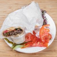 Beef Shawarma · Marinated beef shredded. Served with rice, hummus, greek salad, and pita bread.
