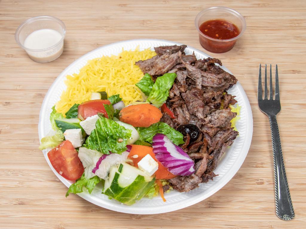 Beef Shawarma Salad Plate · Marinated beef shawarma shredded. Served with greek salad, tahini sauce, and pita bread.