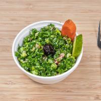 Taboulli · Mixed of fresh parsley, mint, and bulgur wheat finely chopped.