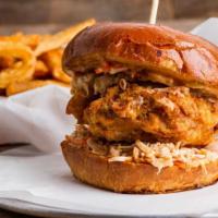 Crispy Chicken Burger · Gourmet bun with homemade battered chicken, dill pickle, tangy homemade coleslaw, house sauce