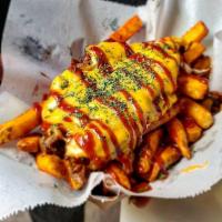 Brisket Fries · fries, house sauce, slow cooked brisket, bbq, grilled onions, melted cheese