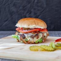 Wagyu Burger · Wagyu patty, American cheese, tomato, pickles, caramelized onions, iceberg lettuce, and Thou...