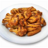 Grilled Wings (20 wings) · The healthier take on wings and grilled. Served with celery, blue cheese, and choice of sauce.