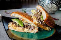 Steak Tortas · Mexican sandwich served with lettuce, tomato, avocado, beans, cheese, and sour cream.